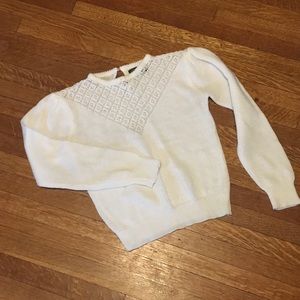 White sweater with v-shape neck detail + pearls